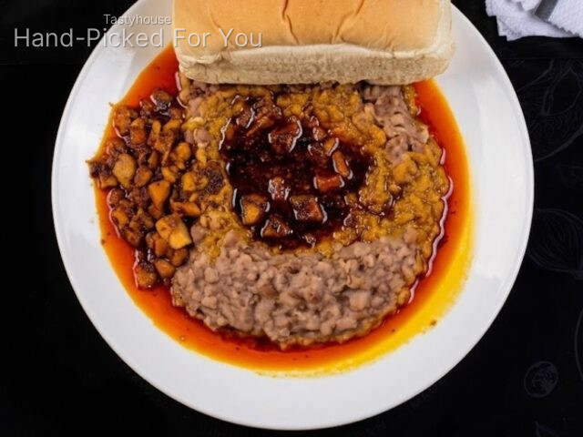 Ewa Agoyin with sauce, bread and fish