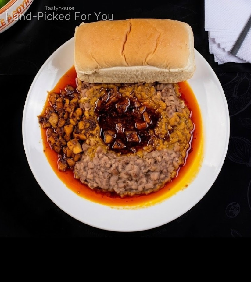 Ewa Agoyin with sauce, bread and fish