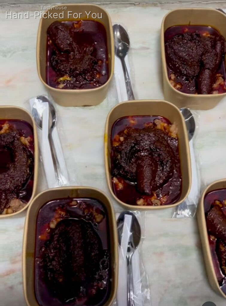 Ewa Agoyin with sauce, bread and fish