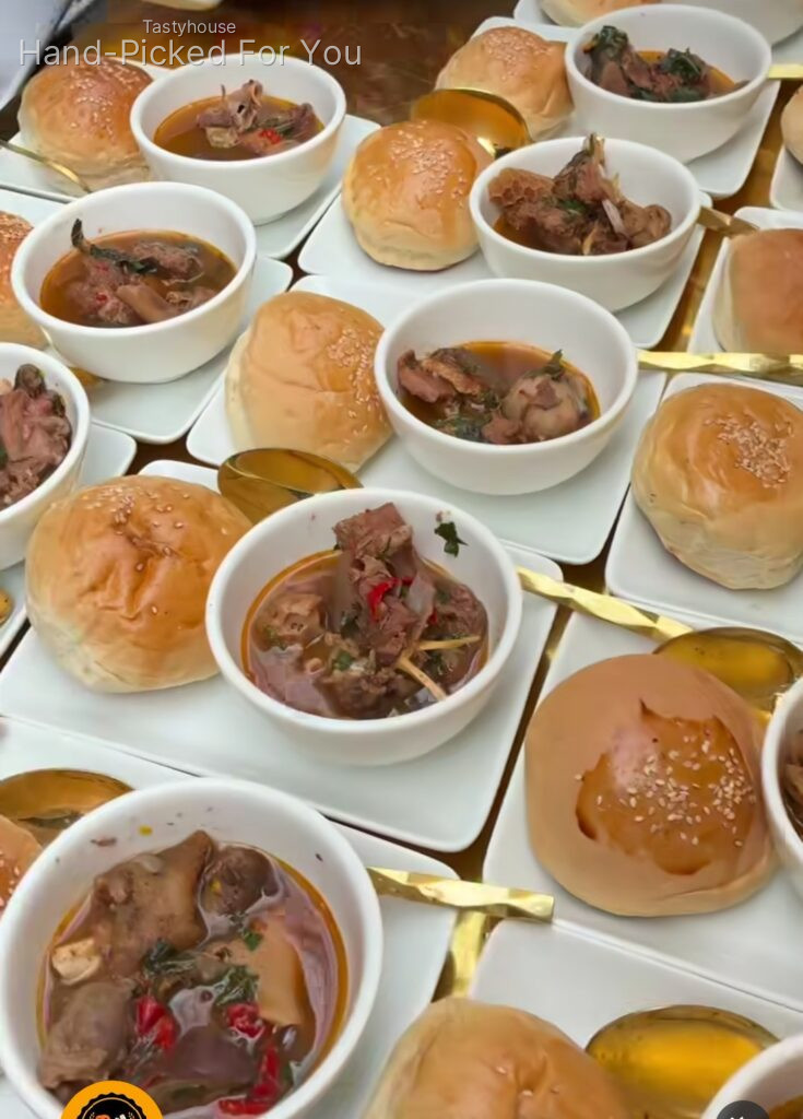 Goatmeat peppersoup and breadbun