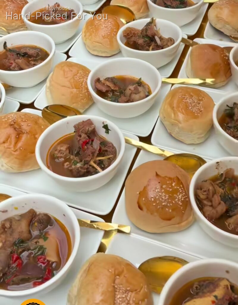 Goatmeat peppersoup and breadbun