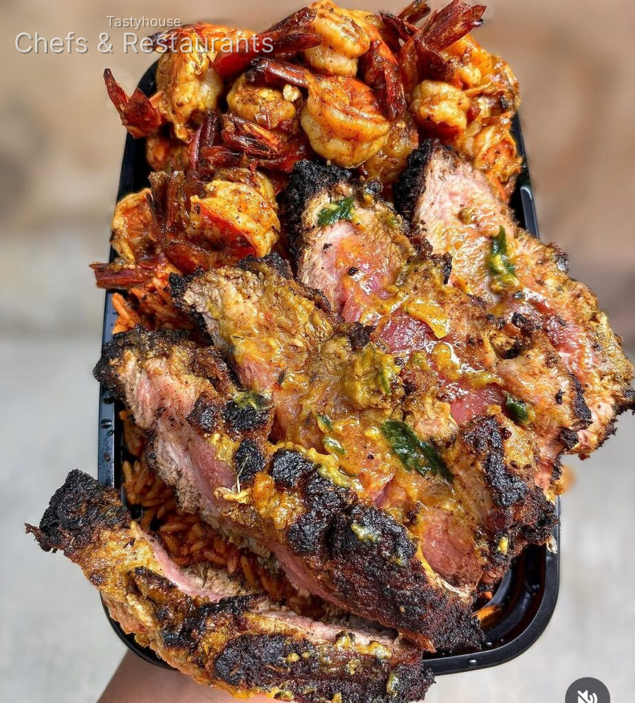 Jollof rice seasoned Cajun steak and buttery prawns