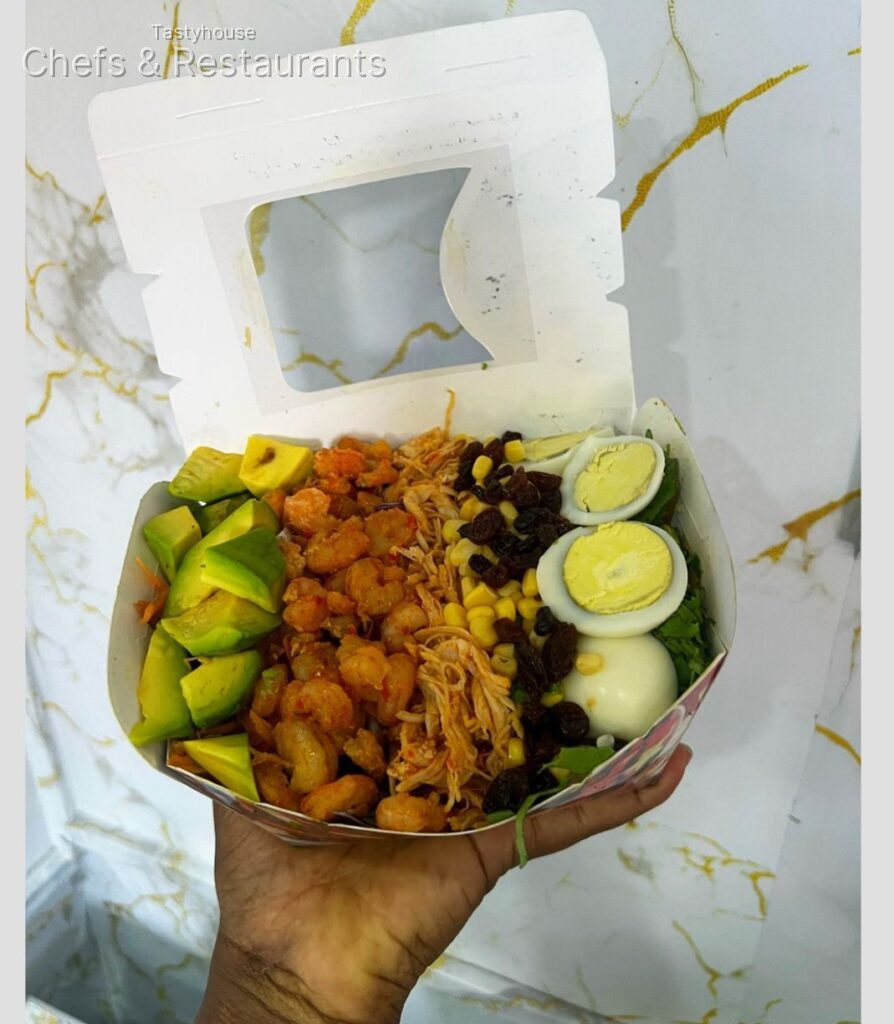 Shrimps chicken eggs and avocado salad