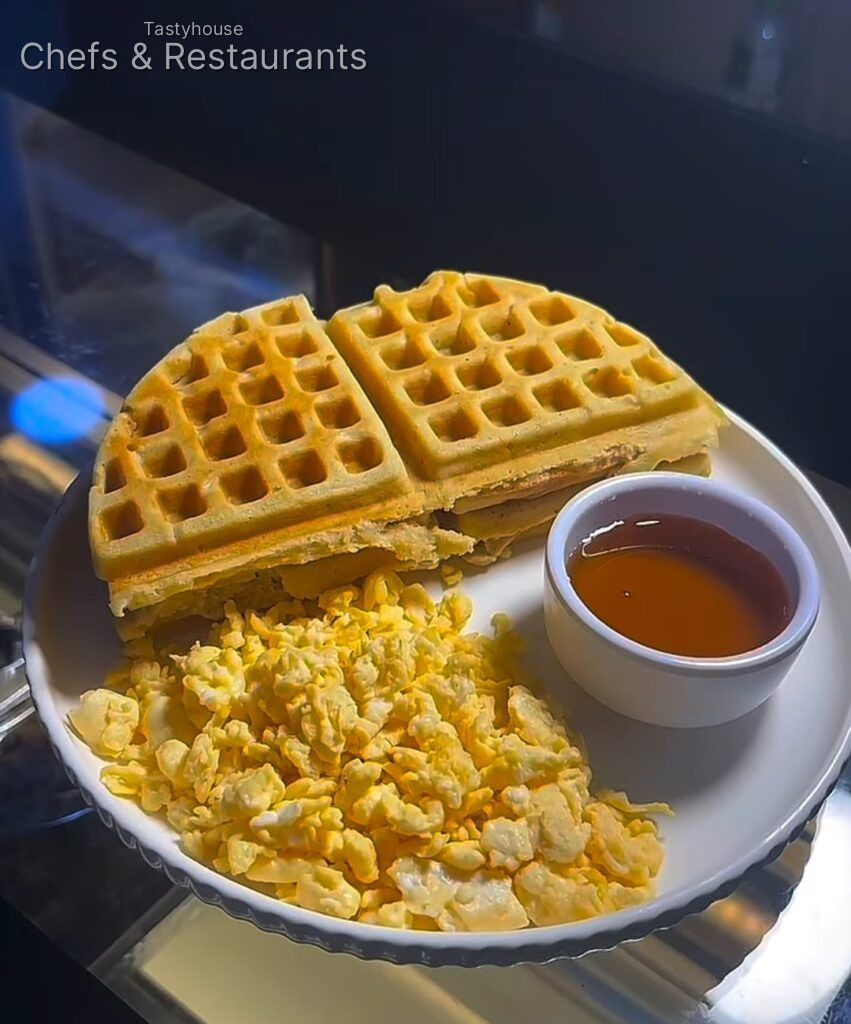 Fluffy waffles, soft scrambled eggs & a generous drizzle of syrup