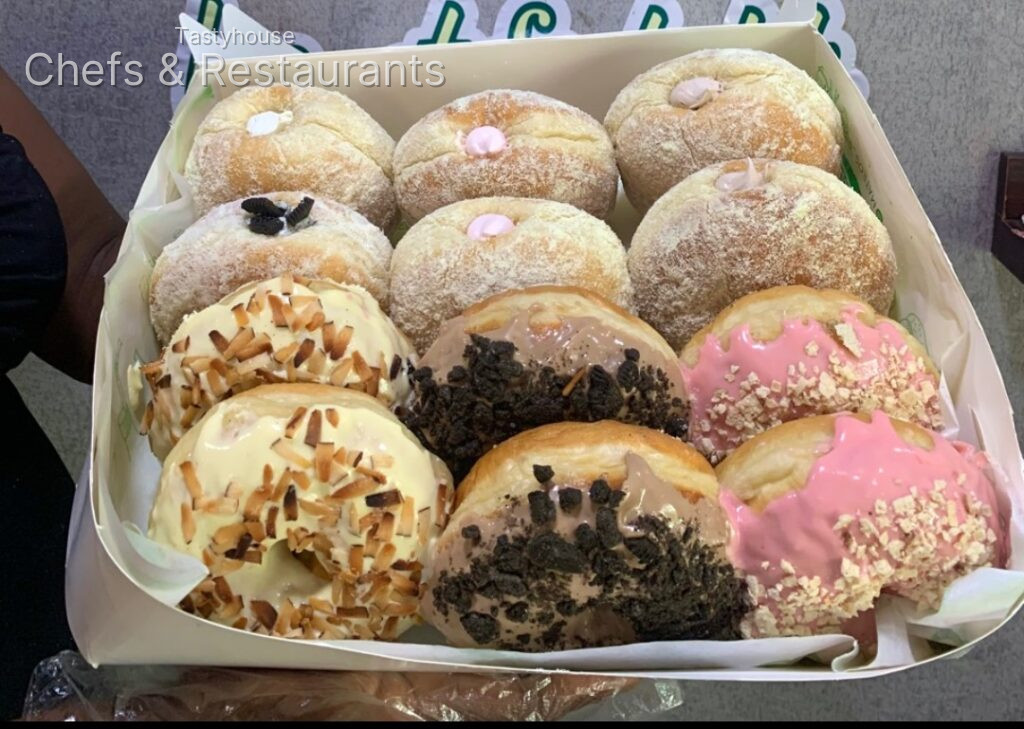 Combo of filled (milk dusted) and glazed donuts